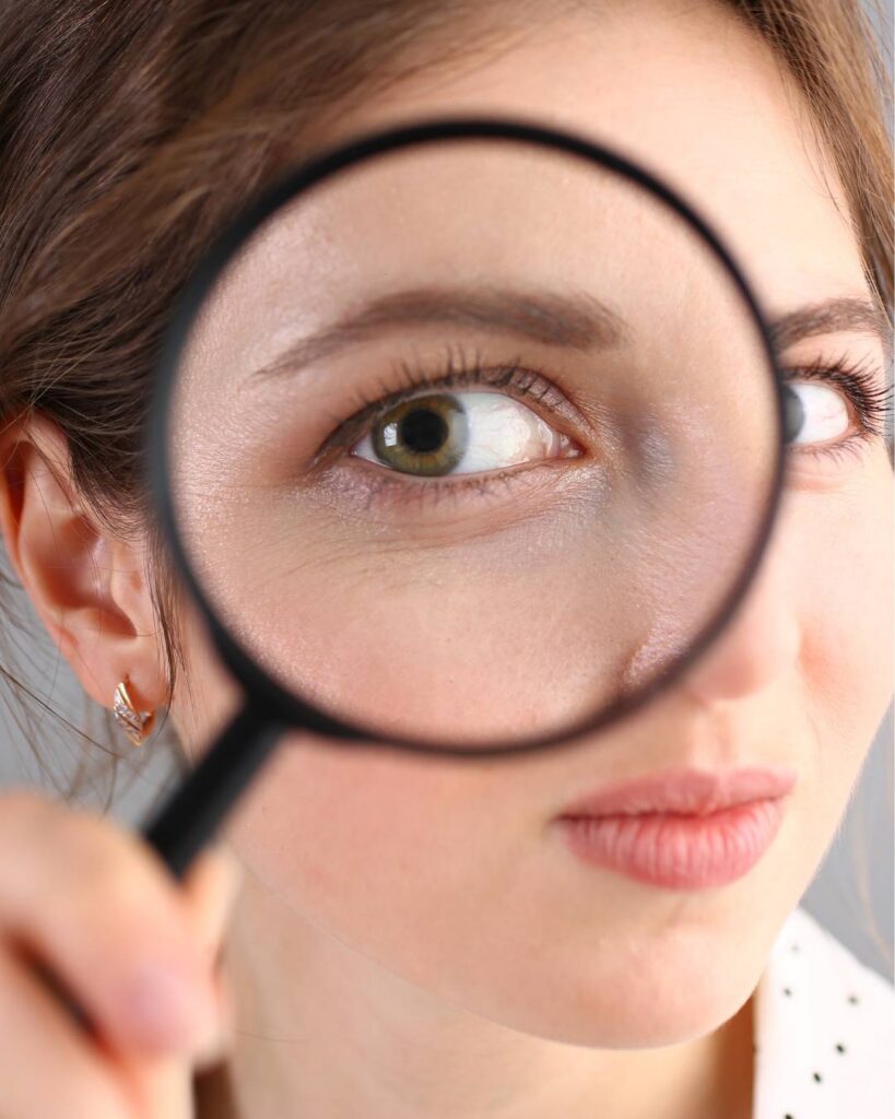 A lady with magnifying glass